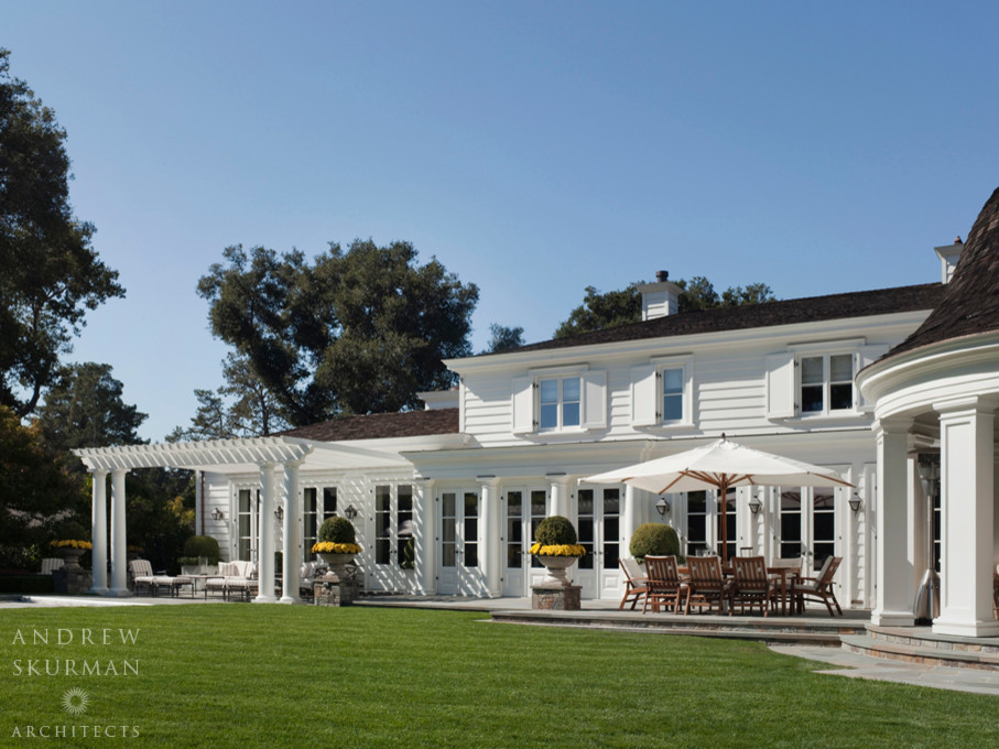 Expansive traditional two-storey white house exterior in San Francisco with wood siding, a hip roof and a shingle roof.
