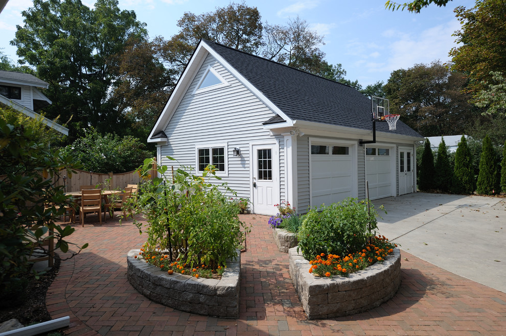 This is an example of a traditional patio in Grand Rapids with a vegetable garden.