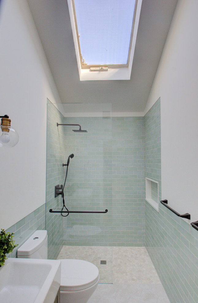 Inspiration for a small coastal shower room bathroom in Other with flat-panel cabinets, distressed cabinets, an alcove shower, a two-piece toilet, blue tiles, ceramic tiles, white walls, marble flooring, a console sink, beige floors, an open shower, white worktops, a wall niche, a single sink and a freestanding vanity unit.