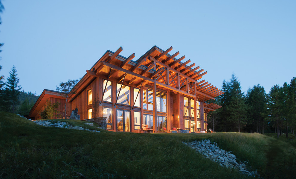 Large modern one-storey brown exterior in Seattle with wood siding and a shed roof.