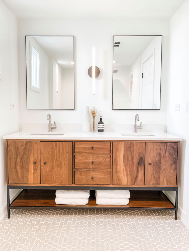 Inspiration for a small mid-century modern master white tile ceramic tile, beige floor and double-sink corner shower remodel in Chicago with flat-panel cabinets, medium tone wood cabinets, white walls, an undermount sink, quartz countertops, white countertops, a freestanding vanity, a two-piece toilet and a hinged shower door