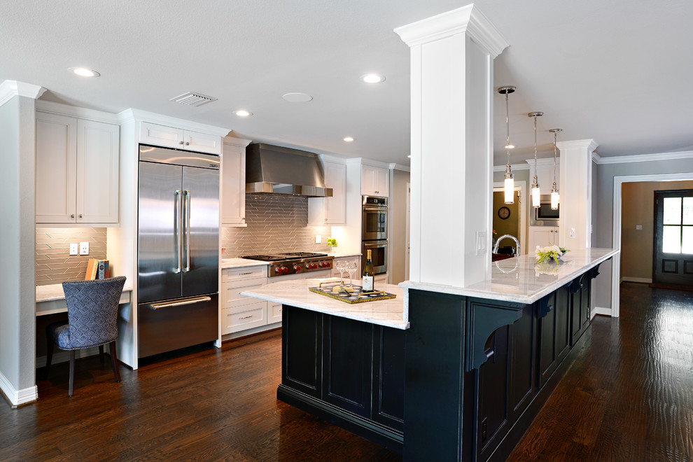 Example of a large transitional single-wall dark wood floor eat-in kitchen design in Dallas with a farmhouse sink, shaker cabinets, white cabinets, marble countertops, beige backsplash, glass tile backsplash, stainless steel appliances and an island
