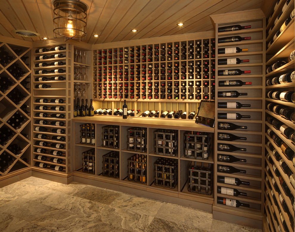 Expansive transitional wine cellar in Milwaukee with storage racks and beige floor.