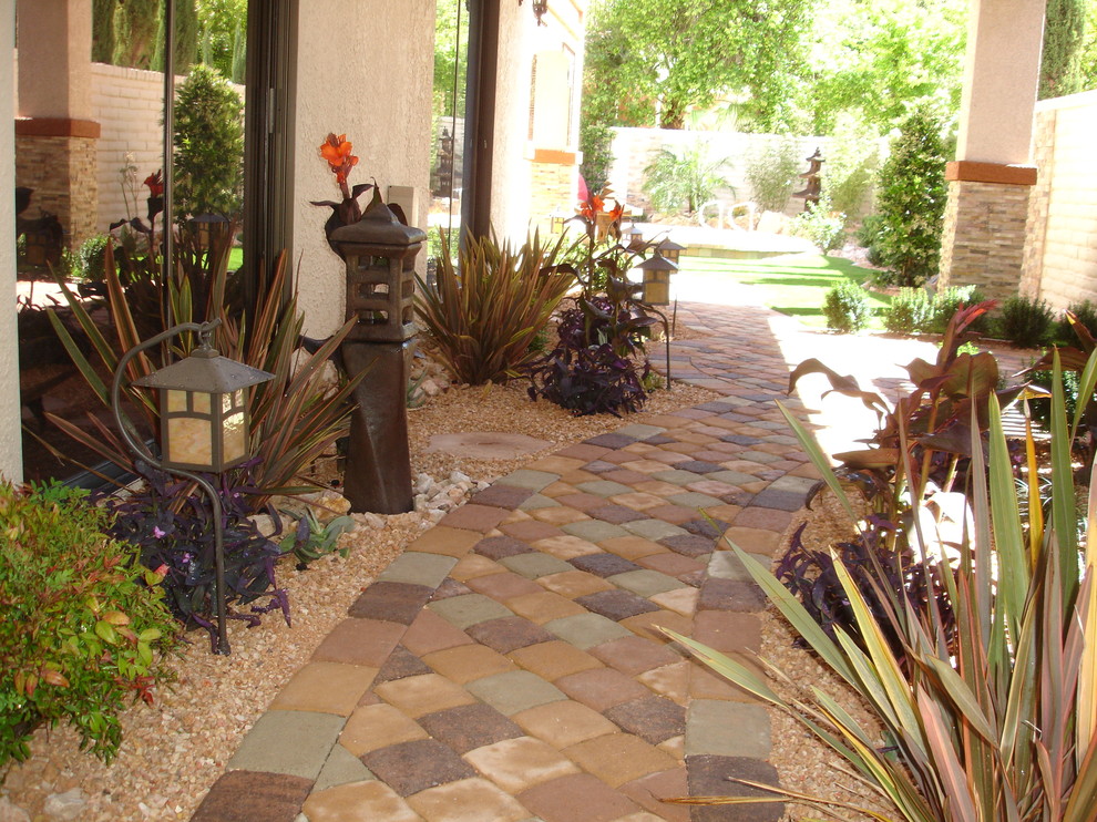 Mid-sized asian side yard garden in Las Vegas with brick pavers.