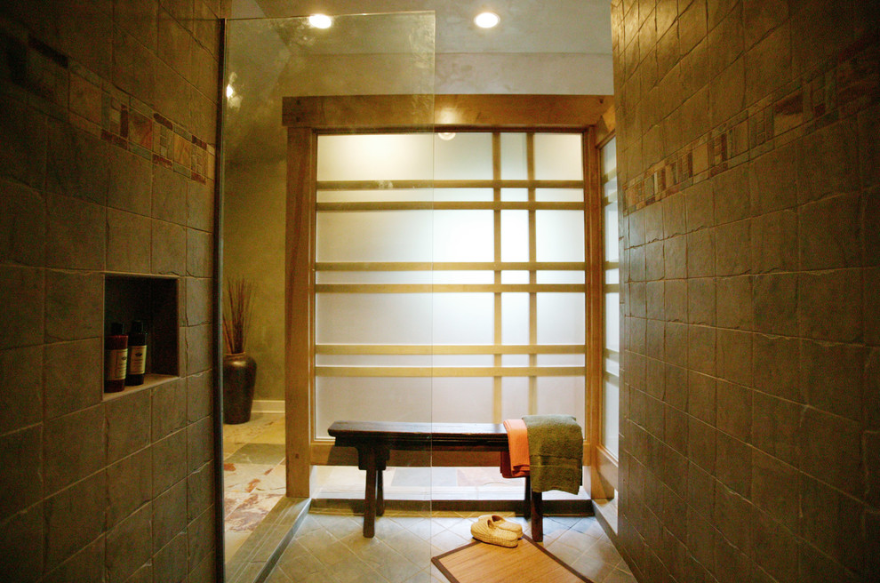 Photo of an asian master bathroom in Charlotte with furniture-like cabinets, light wood cabinets, an open shower, multi-coloured tile, slate, a vessel sink, copper benchtops and an open shower.