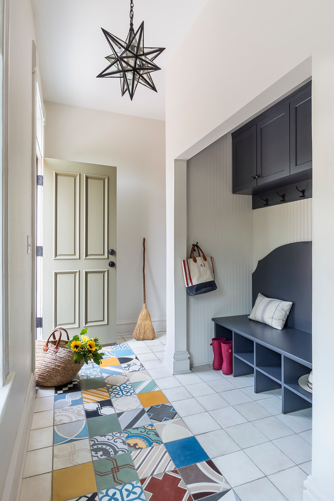 Transitional entryway in Minneapolis with a single front door, a gray front door and multi-coloured floor.