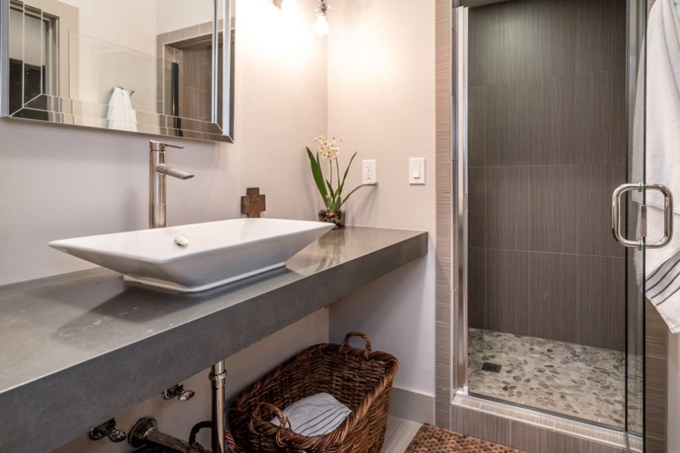 This is an example of a transitional bathroom in Louisville with grey cabinets, an alcove shower, gray tile, cement tile, white walls, cement tiles, a vessel sink, concrete benchtops, grey floor, a hinged shower door, grey benchtops, a single vanity and a floating vanity.