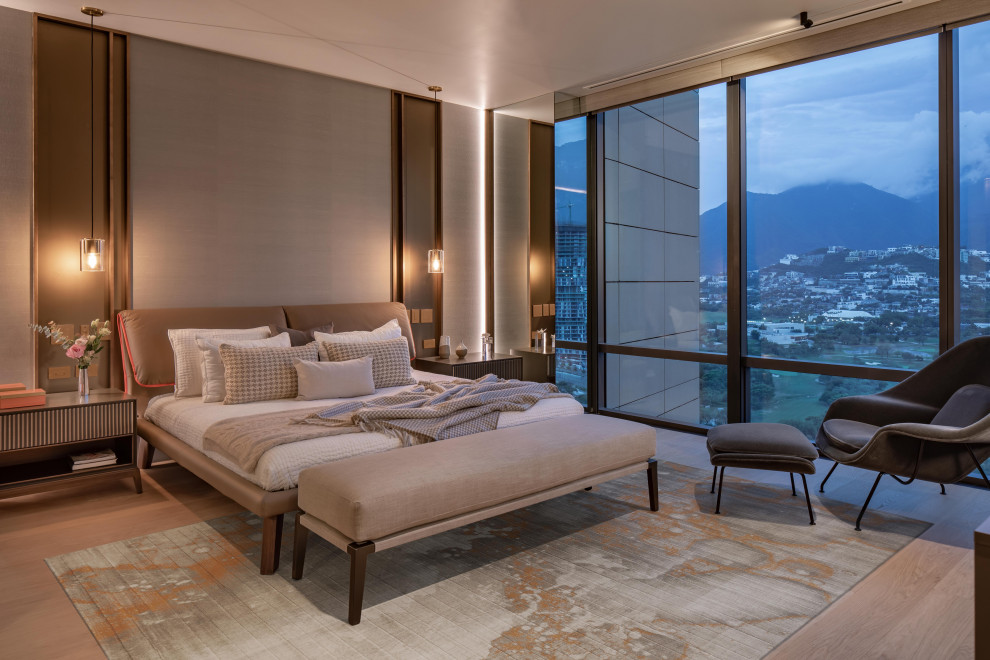 Inspiration for a contemporary bedroom in Mexico City with grey walls, light hardwood floors, beige floor and wallpaper.