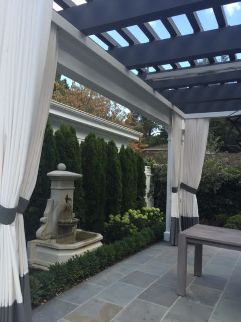 Inspiration for a mid-sized traditional backyard patio in San Francisco with an awning.