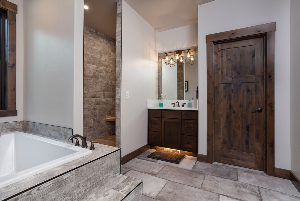 Example of a mountain style master bathroom design