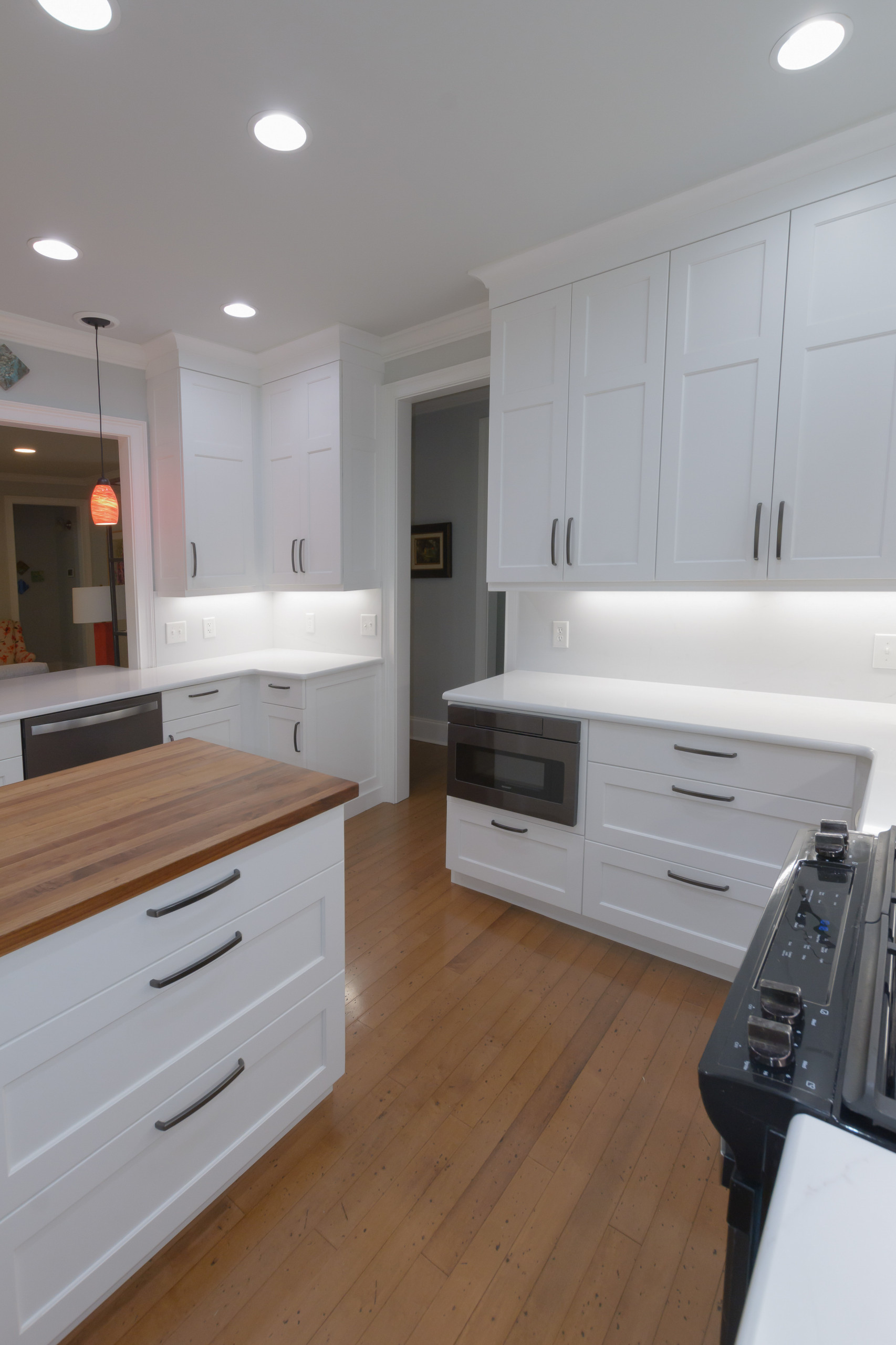 Pawley's Island modern white kitchen with butcher block island