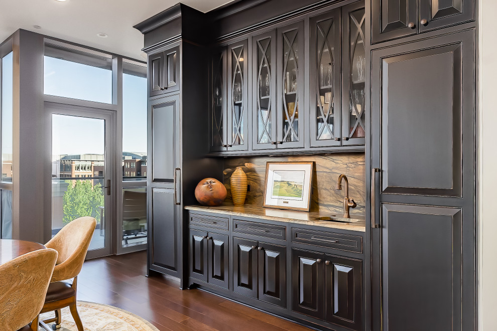 Design ideas for a mid-sized traditional single-wall wet bar in Columbus with beaded inset cabinets, black cabinets, granite benchtops and brown benchtop.