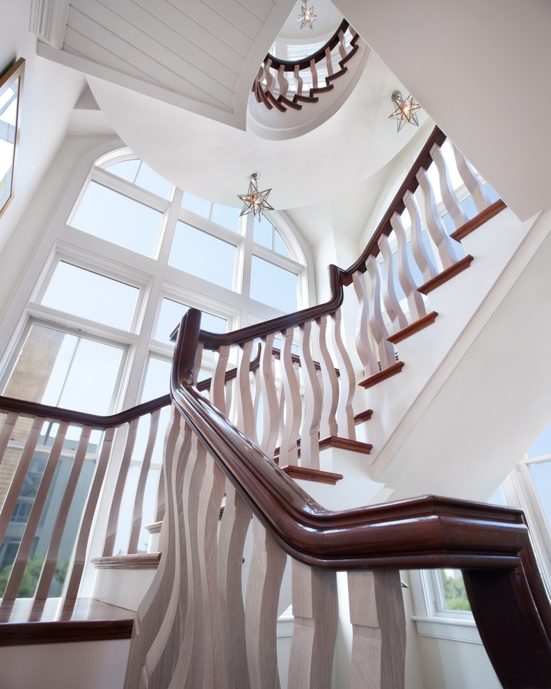 This is an example of a beach style wood staircase in Philadelphia.