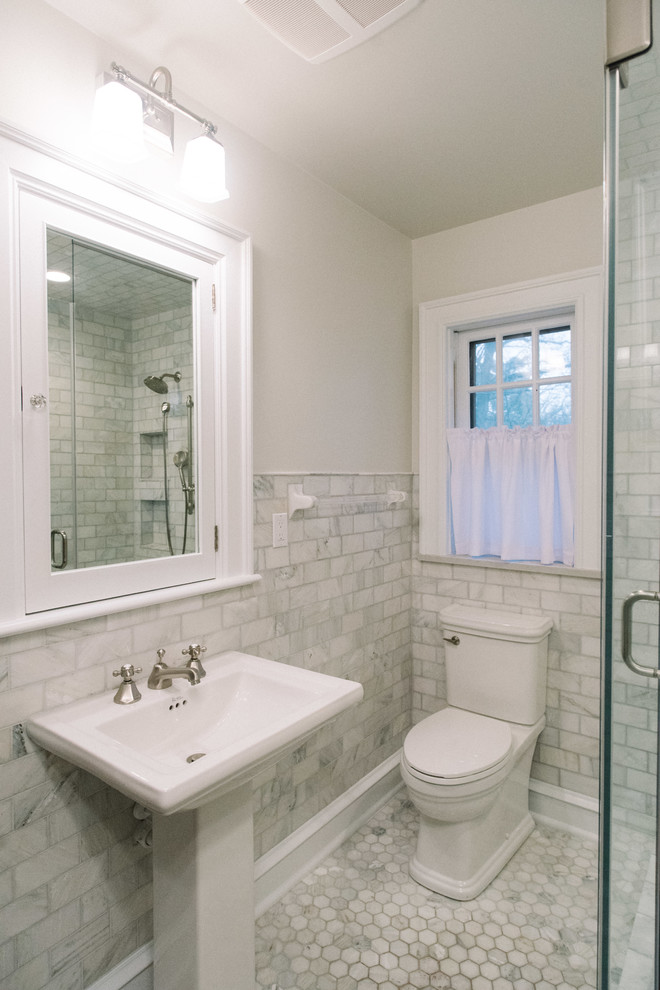 Example of a mid-sized transitional 3/4 gray tile and subway tile marble floor and gray floor double shower design with quartz countertops, a hinged shower door, a two-piece toilet, gray walls and a pedestal sink