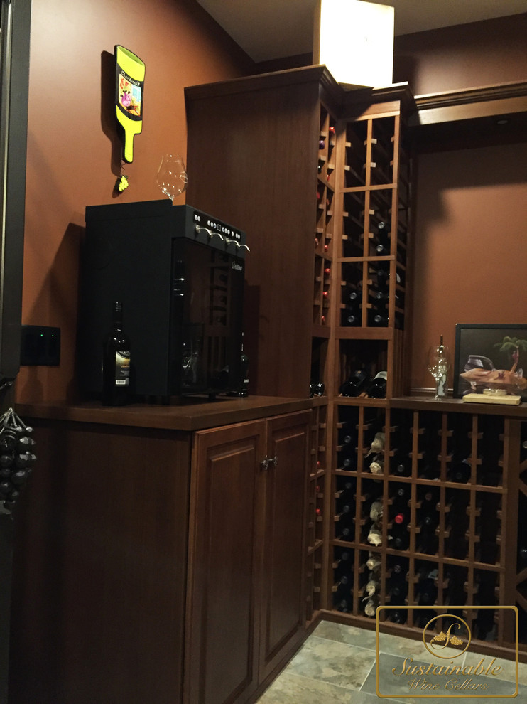 Photo of a large traditional wine cellar in Cincinnati with porcelain floors.