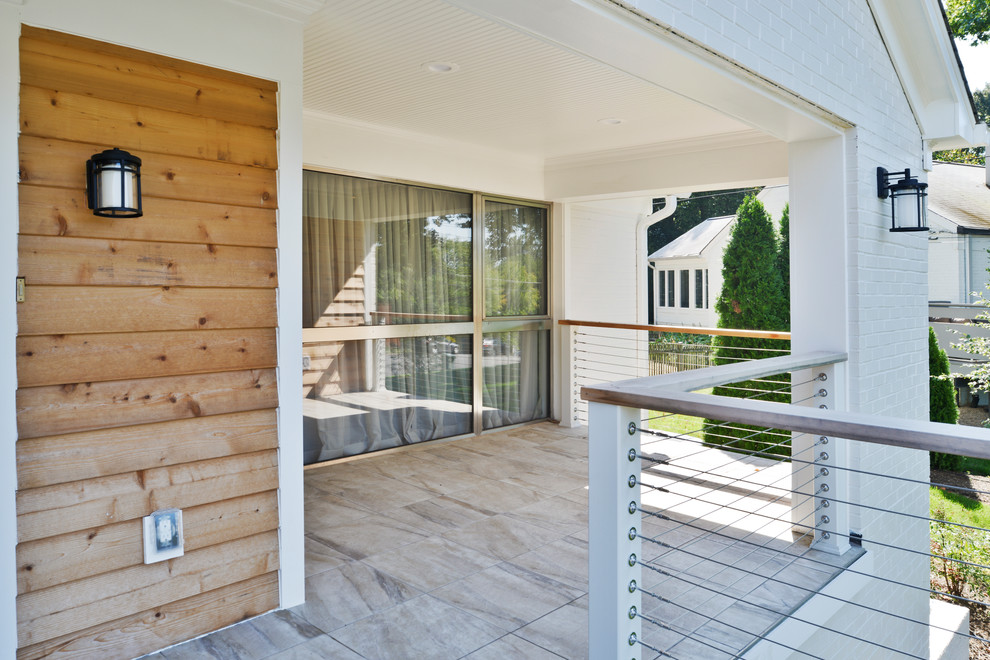 Example of a huge minimalist white two-story mixed siding house exterior design in DC Metro