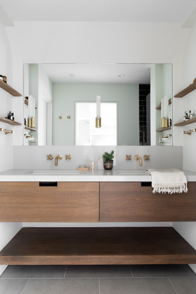 Inspiration for a mid-sized contemporary master bathroom in Boston with flat-panel cabinets, engineered quartz benchtops, a double vanity, dark wood cabinets, white walls, an undermount sink, grey floor, white benchtops and a floating vanity.