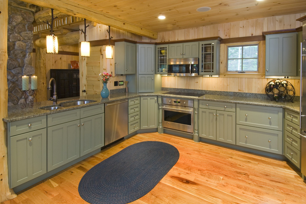 Design ideas for a country kitchen in Boston with a double-bowl sink, recessed-panel cabinets, green cabinets and stainless steel appliances.