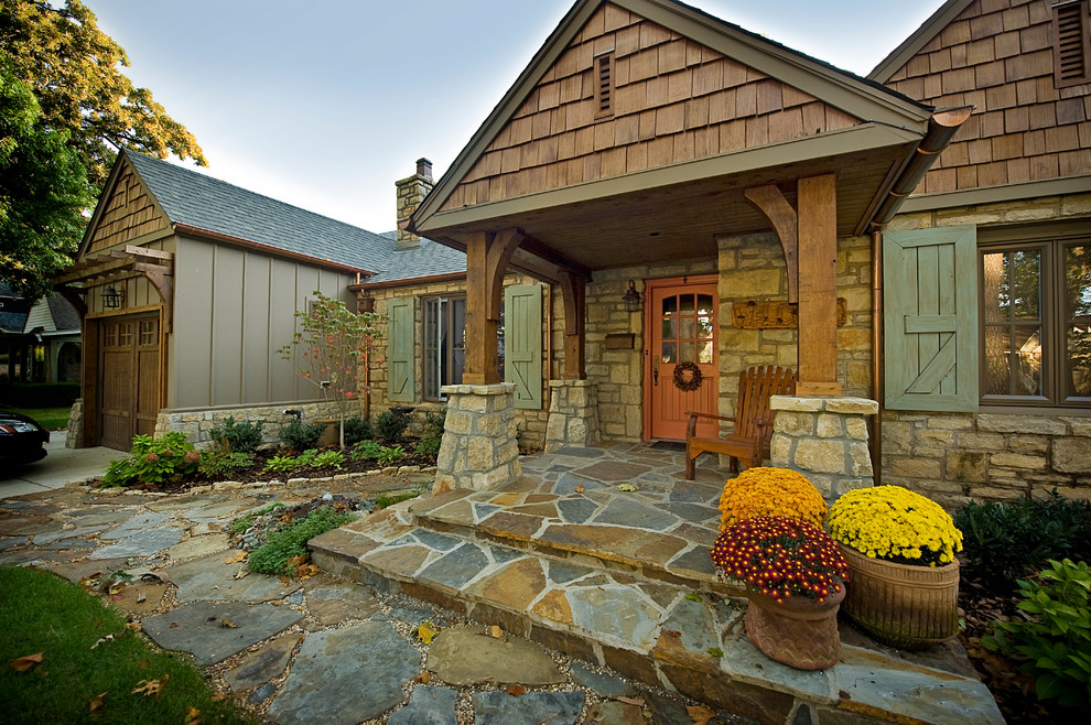 Inspiration for a large rustic slate floor front door remodel with beige walls and an orange front door