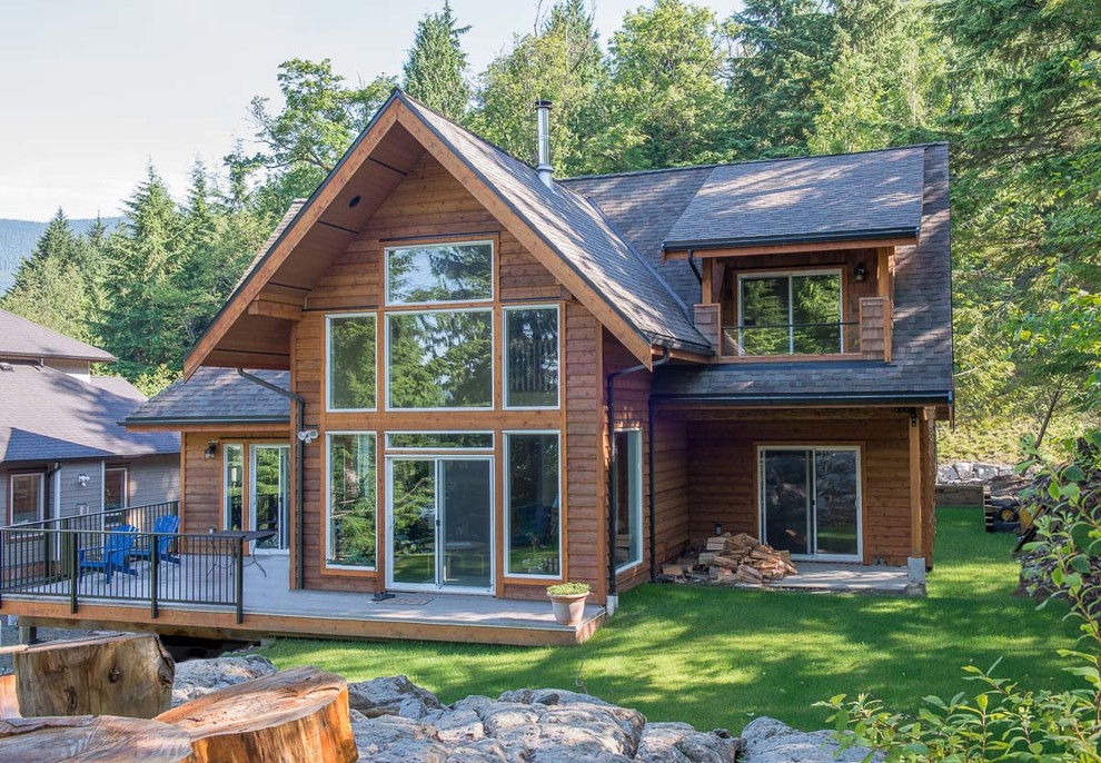 Inspiration for a country two-storey exterior in Vancouver with wood siding.