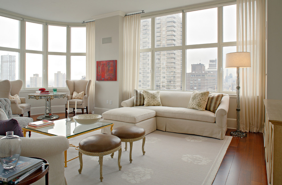 Large contemporary living room in New York with grey walls.