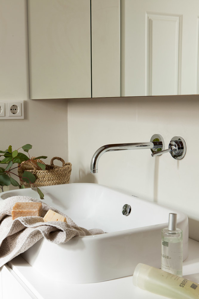 This is an example of a mid-sized scandinavian master bathroom in Other with white walls and a trough sink.