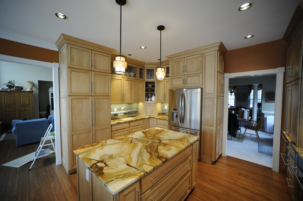 Inspiration for a mid-sized transitional u-shaped light wood floor eat-in kitchen remodel in Baltimore with a farmhouse sink, beaded inset cabinets, light wood cabinets, onyx countertops, stainless steel appliances and an island