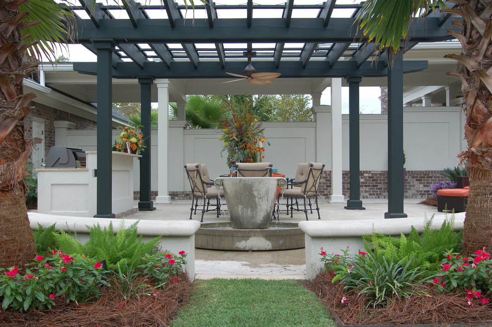Design ideas for a traditional patio in Charleston with an outdoor kitchen and a pergola.