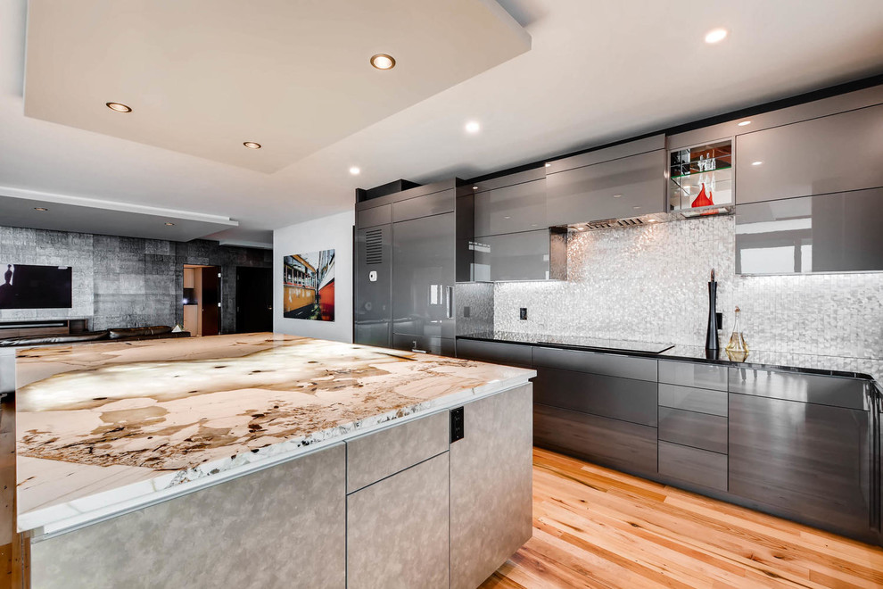 Design ideas for a large contemporary l-shaped eat-in kitchen in Denver with an undermount sink, flat-panel cabinets, grey cabinets, granite benchtops, mosaic tile splashback, panelled appliances and with island.