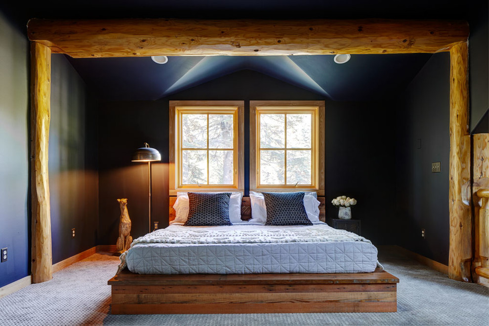 Country bedroom in Seattle with blue walls and carpet.