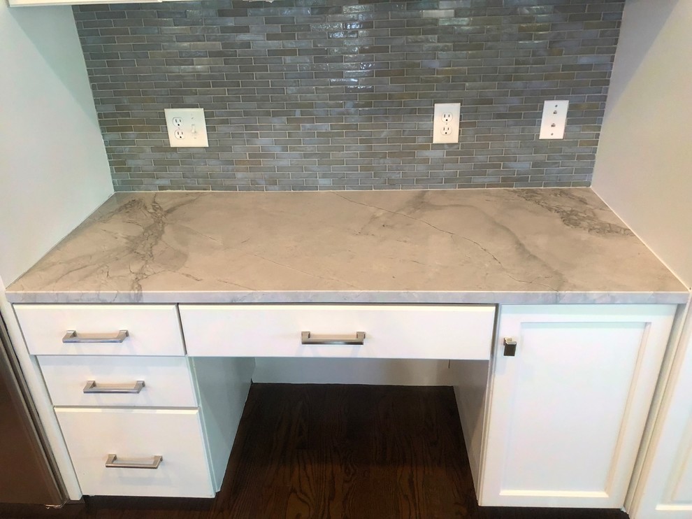 Photo of an expansive contemporary l-shaped kitchen pantry in Boston with an undermount sink and with island.