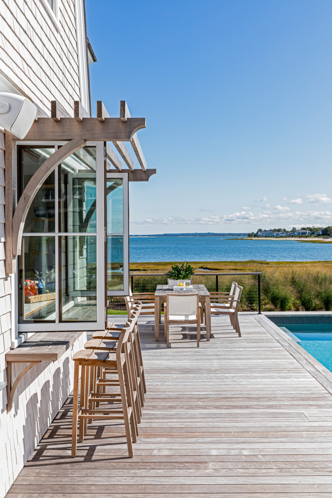Design ideas for a large beach style side wire cable railing terrace in Boston with no cover.