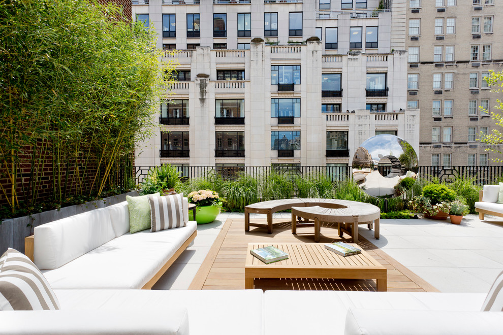 This is an example of an expansive contemporary rooftop and rooftop deck in New York with no cover.