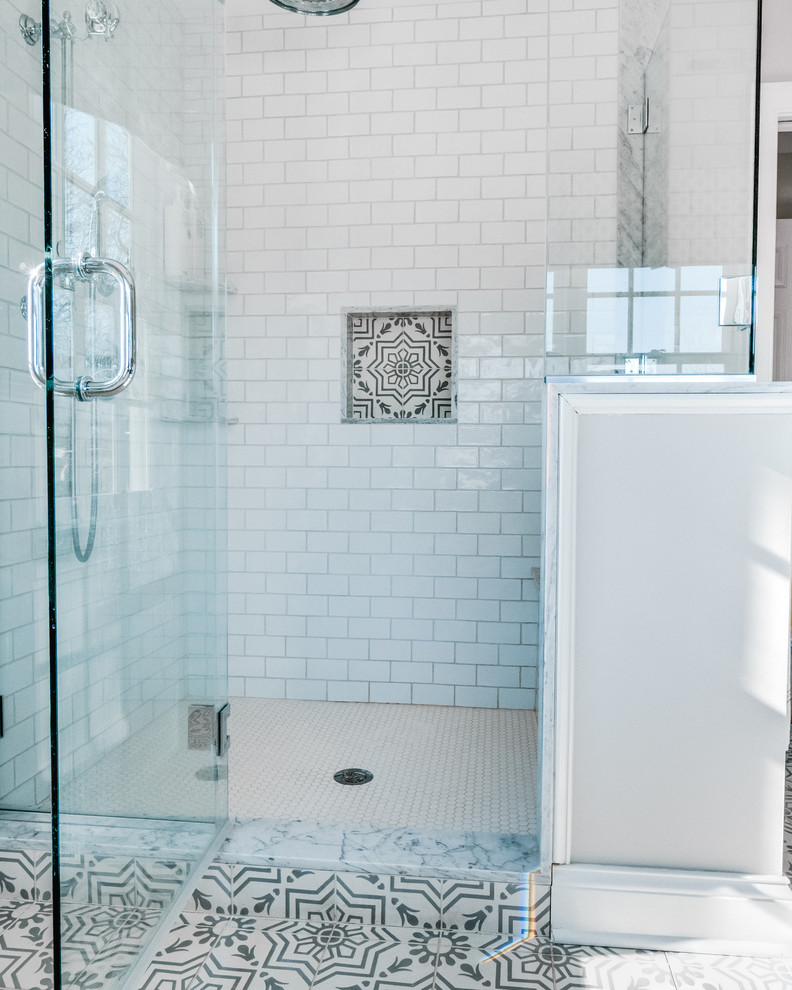 Claw-foot bathtub - mid-sized transitional master white tile and ceramic tile cement tile floor and white floor claw-foot bathtub idea in Philadelphia with raised-panel cabinets, blue cabinets, a two-piece toilet, beige walls, an integrated sink, marble countertops, a hinged shower door and gray countertops