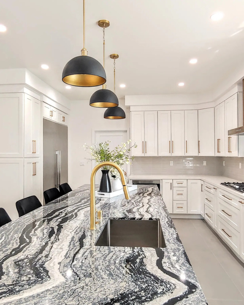 This is an example of a large modern u-shaped separate kitchen in Los Angeles with an undermount sink, shaker cabinets, white cabinets, quartz benchtops, grey splashback, ceramic splashback, stainless steel appliances, porcelain floors, with island, grey floor and multi-coloured benchtop.