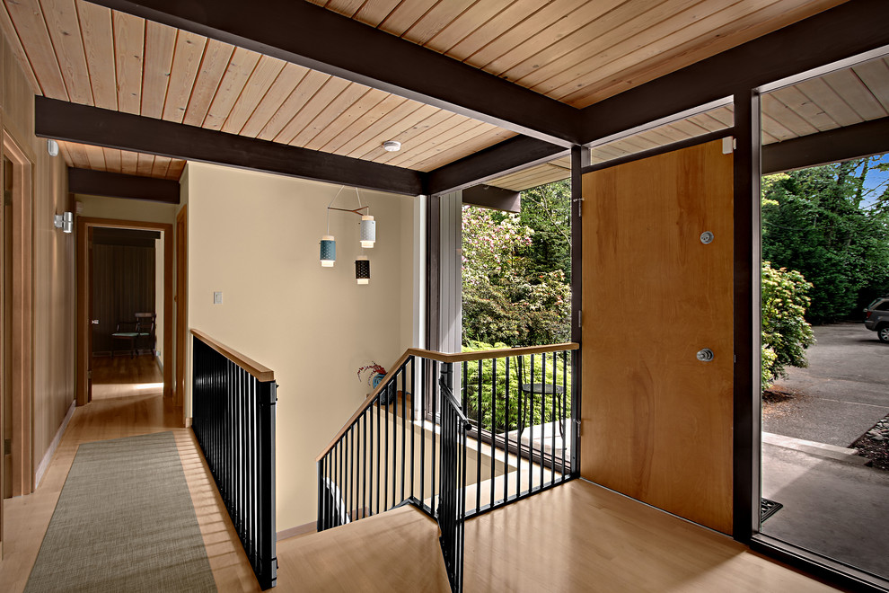 This is an example of a midcentury entry hall in Seattle with a single front door.