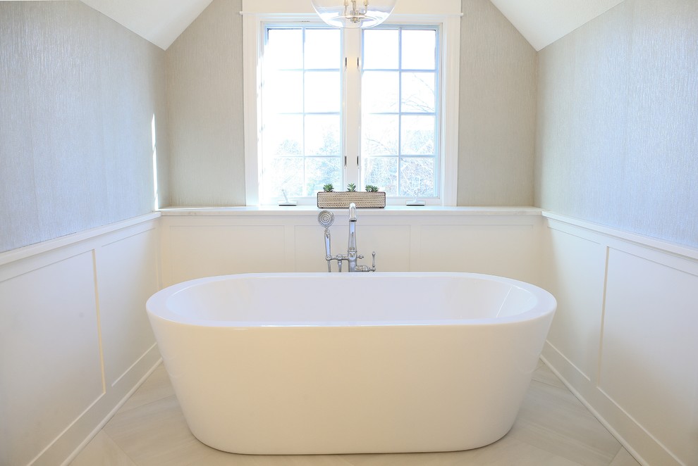 Inspiration for a mid-sized transitional master porcelain tile and white floor freestanding bathtub remodel with shaker cabinets, white cabinets and marble countertops