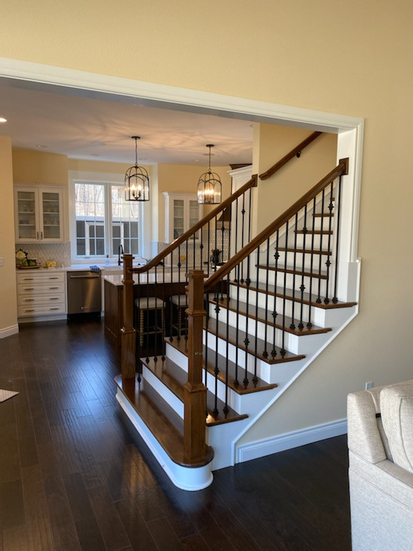 Paint and stain staircase with kitchen view