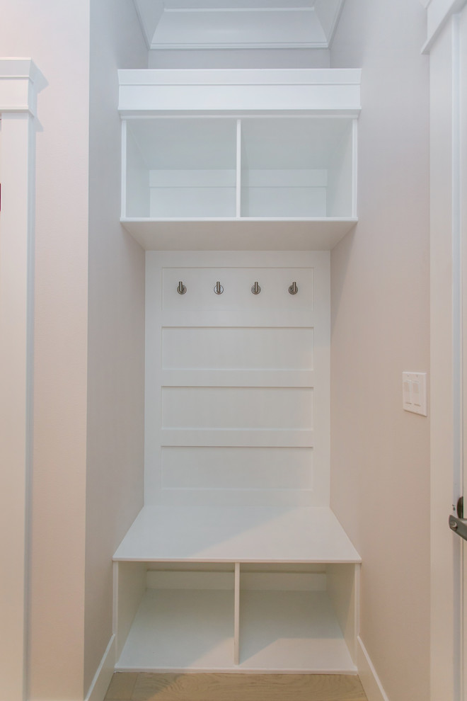 Small transitional light wood floor mudroom photo in Seattle with gray walls