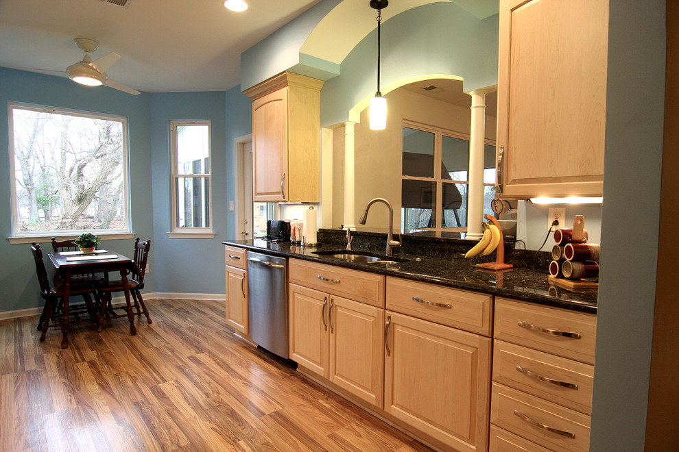 This is an example of a traditional galley eat-in kitchen in Other with granite benchtops.