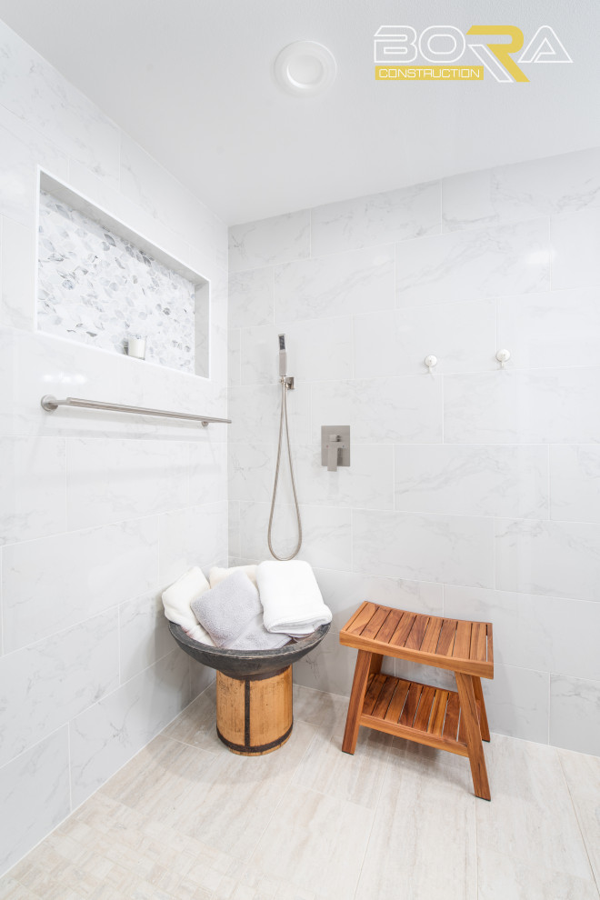 Photo of a large transitional master bathroom in Seattle with shaker cabinets, white cabinets, an alcove shower, a two-piece toilet, white tile, ceramic tile, white walls, ceramic floors, an undermount sink, engineered quartz benchtops, beige floor, an open shower, grey benchtops, an enclosed toilet, a double vanity and a freestanding vanity.