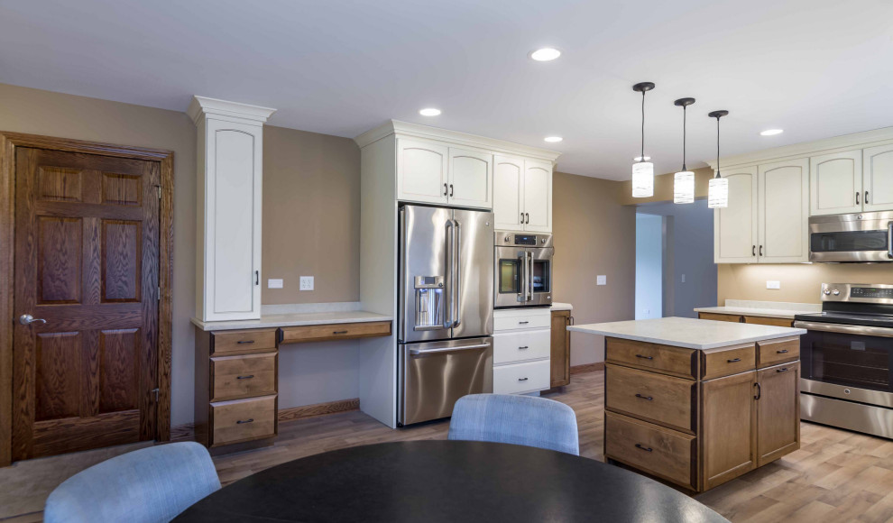 Inspiration for a mid-sized timeless l-shaped light wood floor, beige floor and wallpaper ceiling eat-in kitchen remodel in Chicago with a triple-bowl sink, recessed-panel cabinets, white cabinets, on