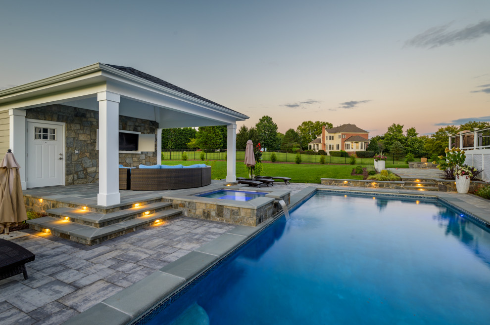 Inspiration for a concrete paver and rectangular pool remodel in DC Metro