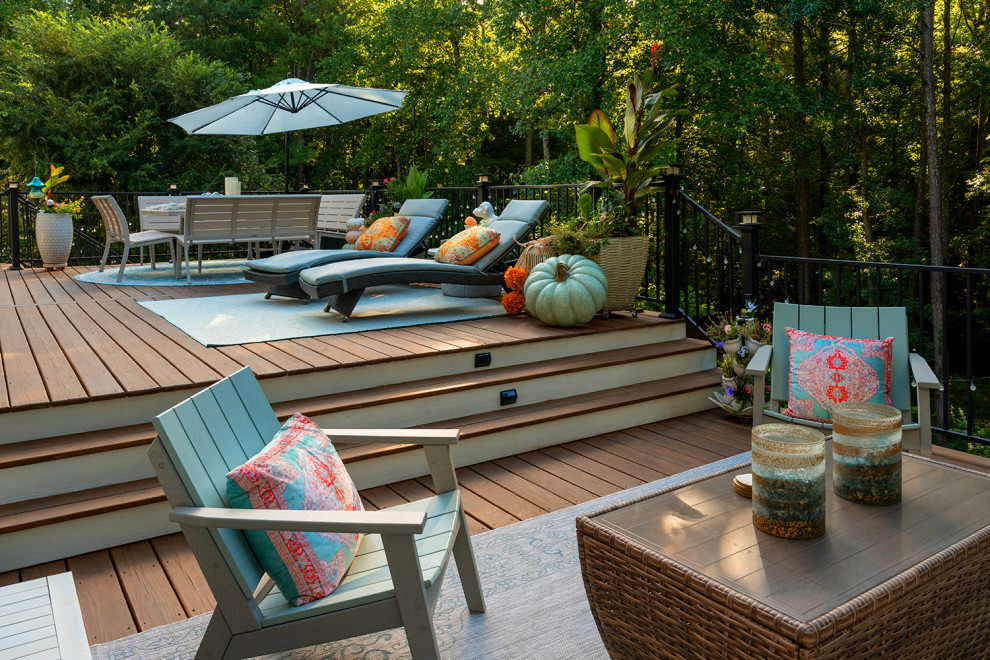 Example of a transitional backyard second story metal railing deck design in Atlanta with a bbq area and no cover