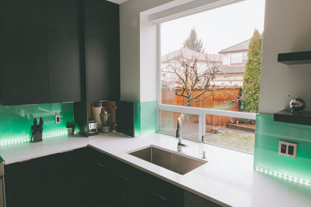 Example of a transitional kitchen design in Vancouver