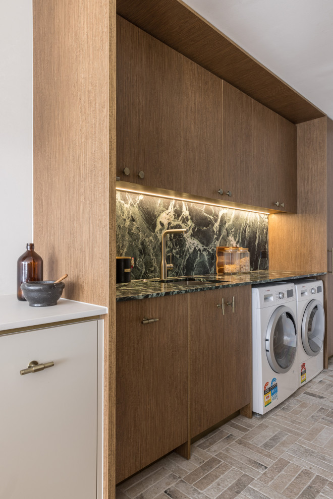 Photo of a contemporary laundry room in Sydney.