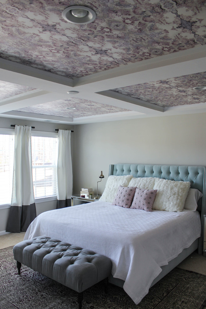 This is an example of a mid-sized transitional master bedroom in Raleigh with carpet.