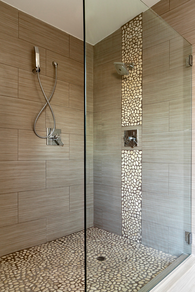 Beach style bathroom in Baltimore with brown tile, pebble tile and pebble tile floors.