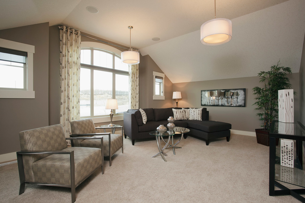 This is an example of a transitional family room in Calgary with carpet.