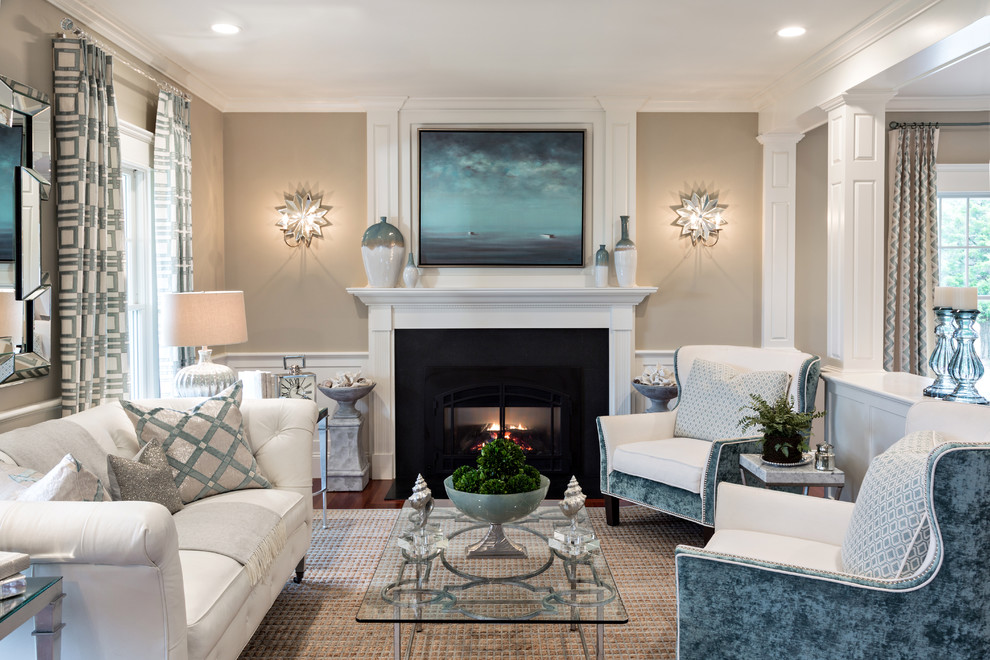 This is an example of a mid-sized transitional formal open concept living room in Boston with beige walls, medium hardwood floors, a standard fireplace, a plaster fireplace surround and no tv.